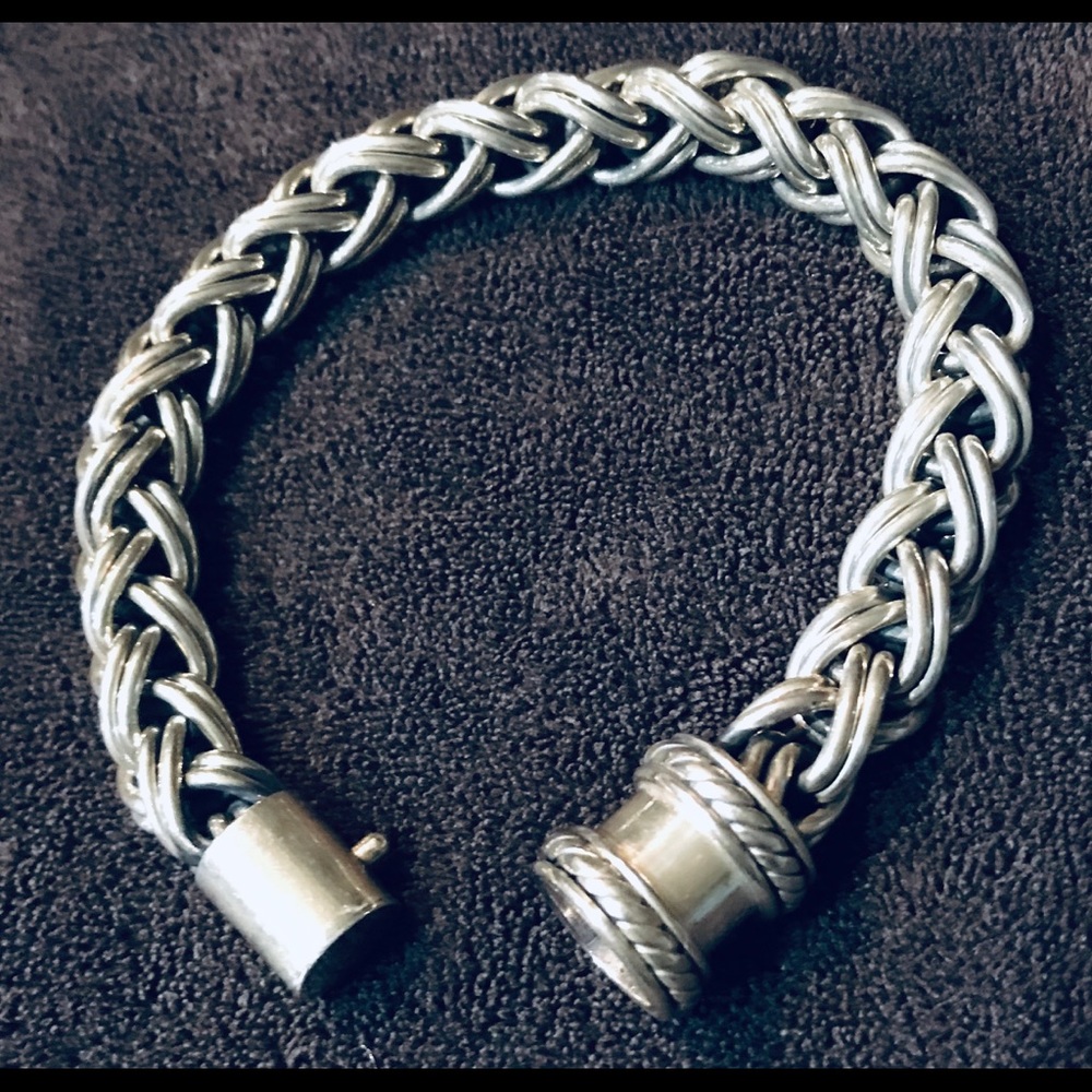 Heavy silver bracelet with special closure.